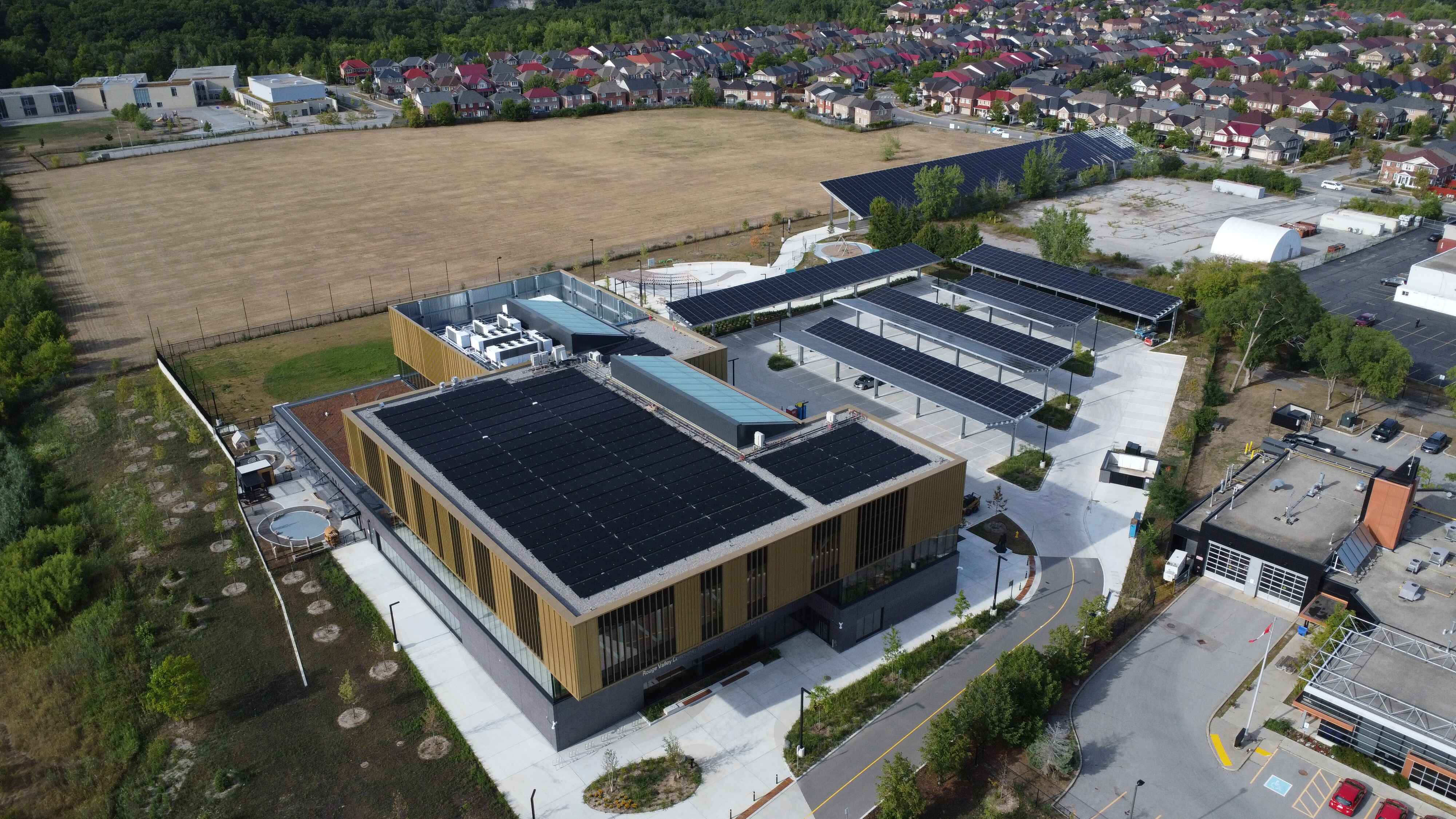 Solar panels on roof and parking canopy
